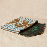 Open gold, white and blue beaded geometric bag with colorful kanga lining