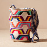 Colorful woven bag with geometric pattern on a beige background