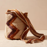 Woven bag with brown and beige pattern on a light background