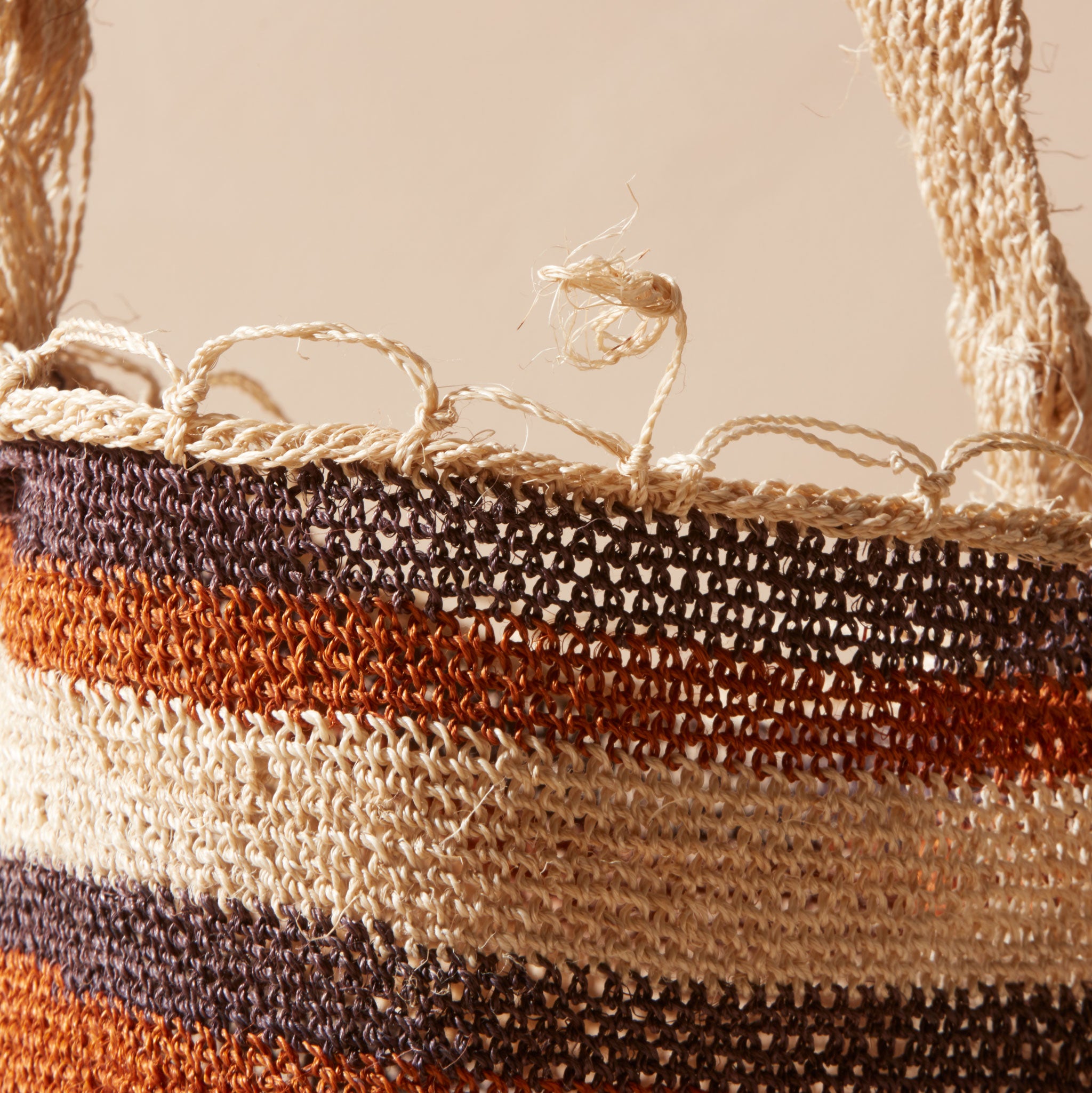 Close up view of woven striped bag