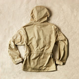 Back view of the khaki ranger safari hooded jacket against sand background