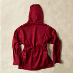 Red ranger safari jacket back view against a sand background