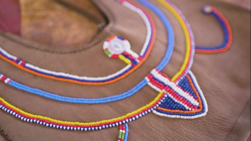 Video close up of the colorful hand beading on the Maasai Bag